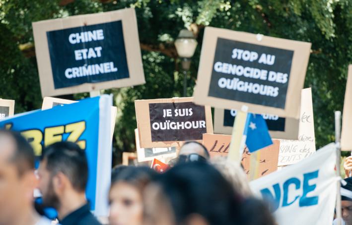 Uighur human rights activists participate in a demonstration to protest against Chinese government's policy against the Uighur people