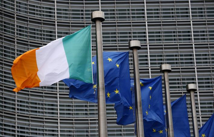 European and Irish flags waving outside of the European Commission offices