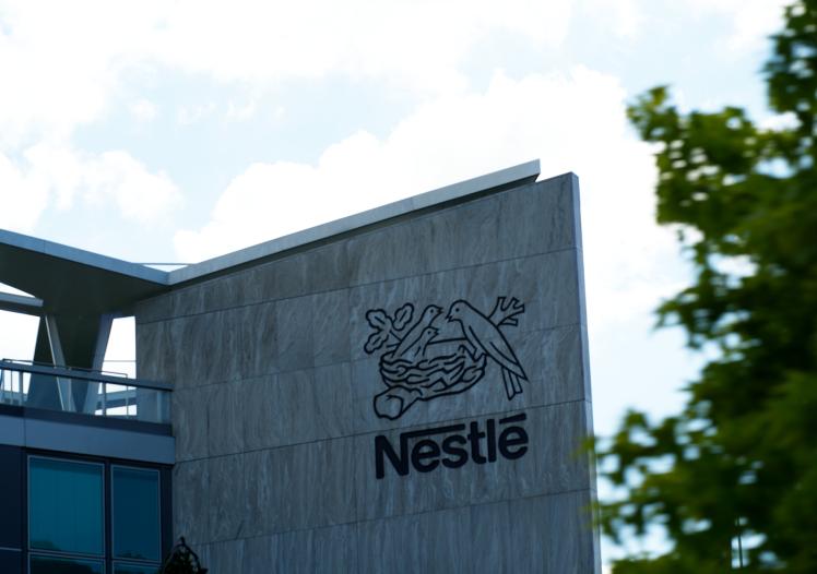 Emblem of food company Nestlé at headquarters