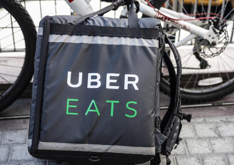 Uber Eats backpack next to a bike
