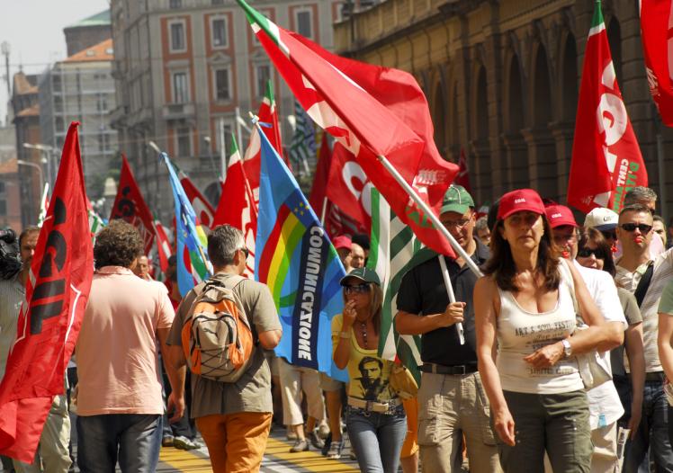March of strikers in the telecommunications sector during a strike in the city of Bologna