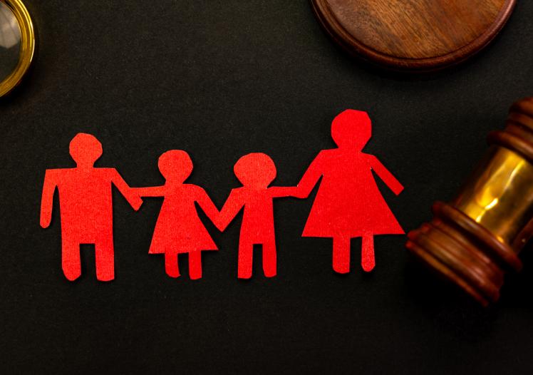 Paper chain family next to gavel