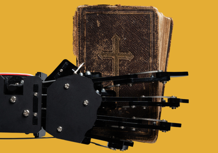 Robot's hand with ancient Bible