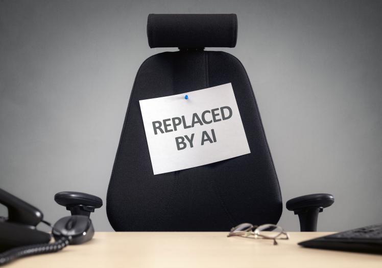 Empty office chair with replaced by AI sign