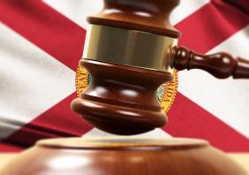 Wood Gavel Standing Front Of the Florida State Flag