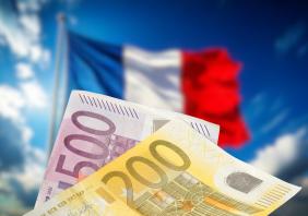 Flags of France and money Euro banknotes 
