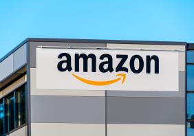 Amazon logo on the side of a warehouse 