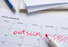 Red markig crossing days off a calendar for sick leave 