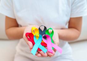 Woman holding cancer awareness ribbons