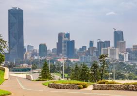 Central business district with modern skyscrapers of downtown of Addis Ababa road and green park in the foreground, Ethiopia stock photo