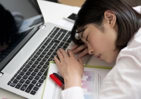 Worker asleep at desk