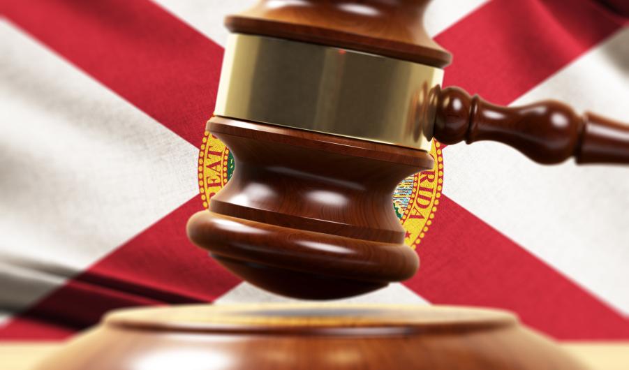 Wood Gavel Standing Front Of the Florida State Flag