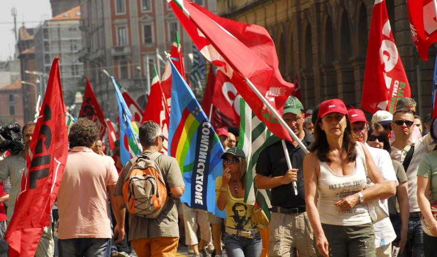 March of strikers in the telecommunications sector during a strike in the city of Bologna