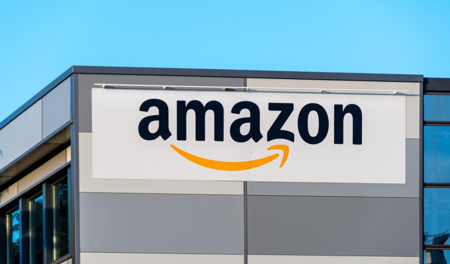 Amazon logo on the side of a warehouse 