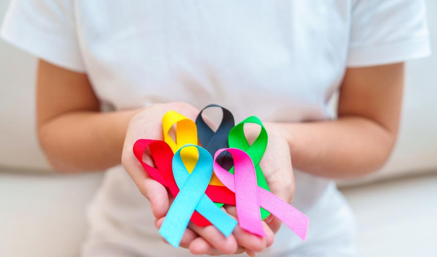 Woman holding cancer awareness ribbons