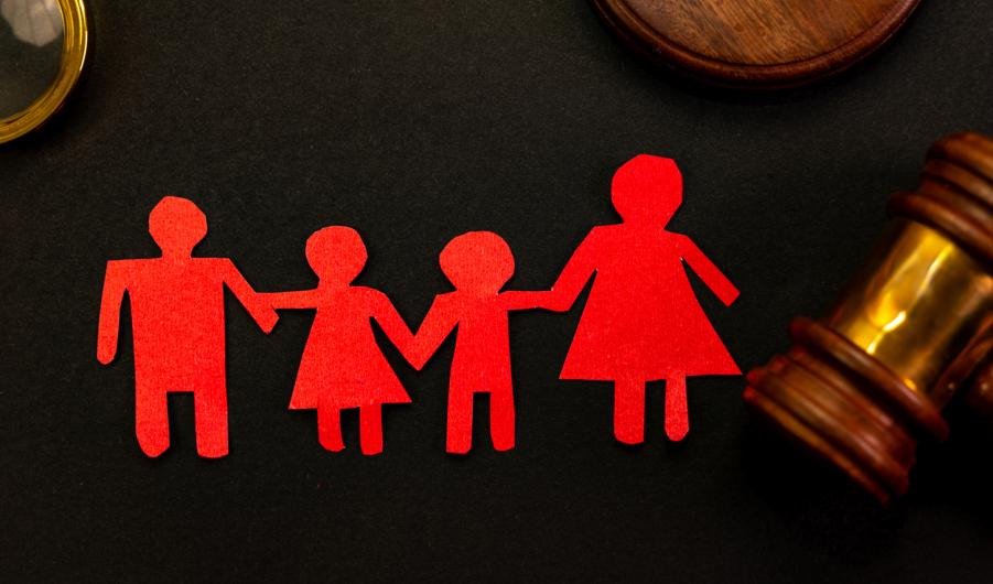 Paper chain family next to gavel