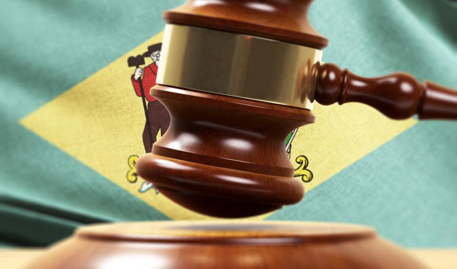 Wood Gavel Standing Front Of the Delaware State Flag