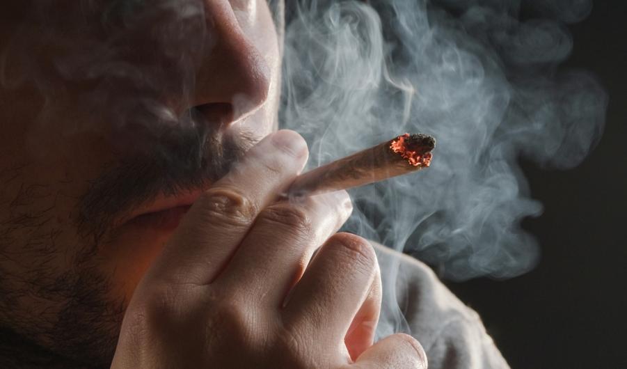 Man smoking a cannabis cigarette
