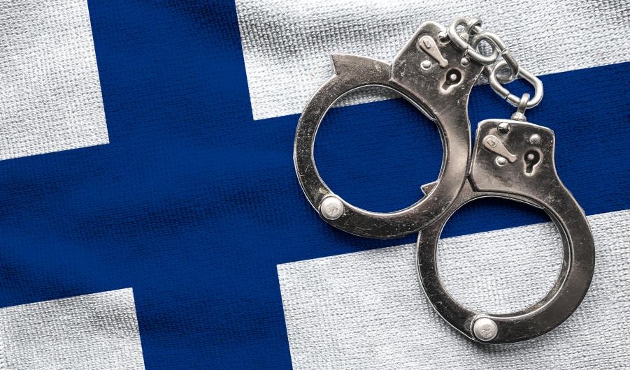 Flag of Finland and police handcuffs
