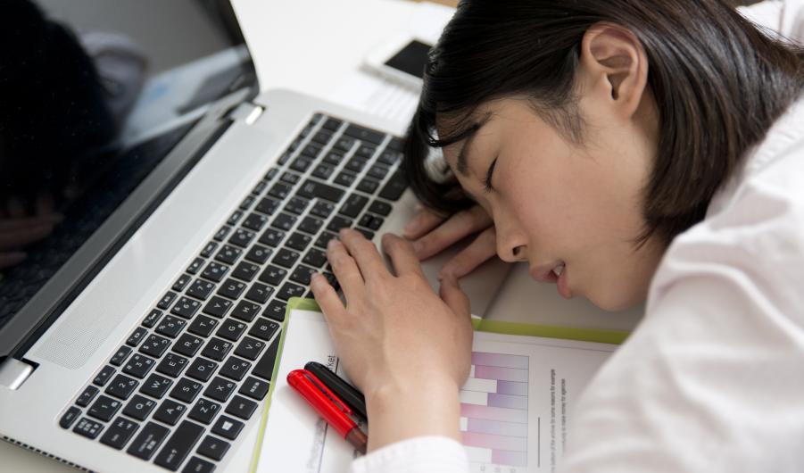Worker asleep at desk