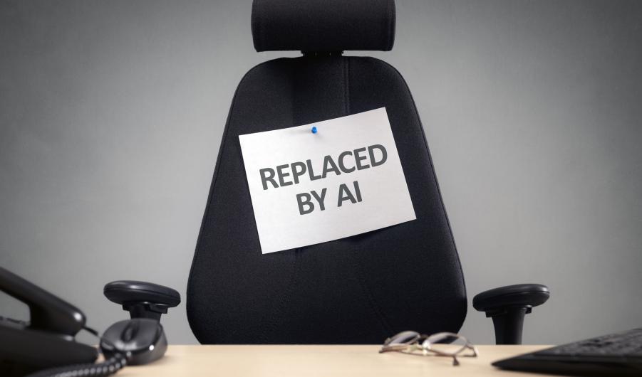 Empty office chair with replaced by AI sign